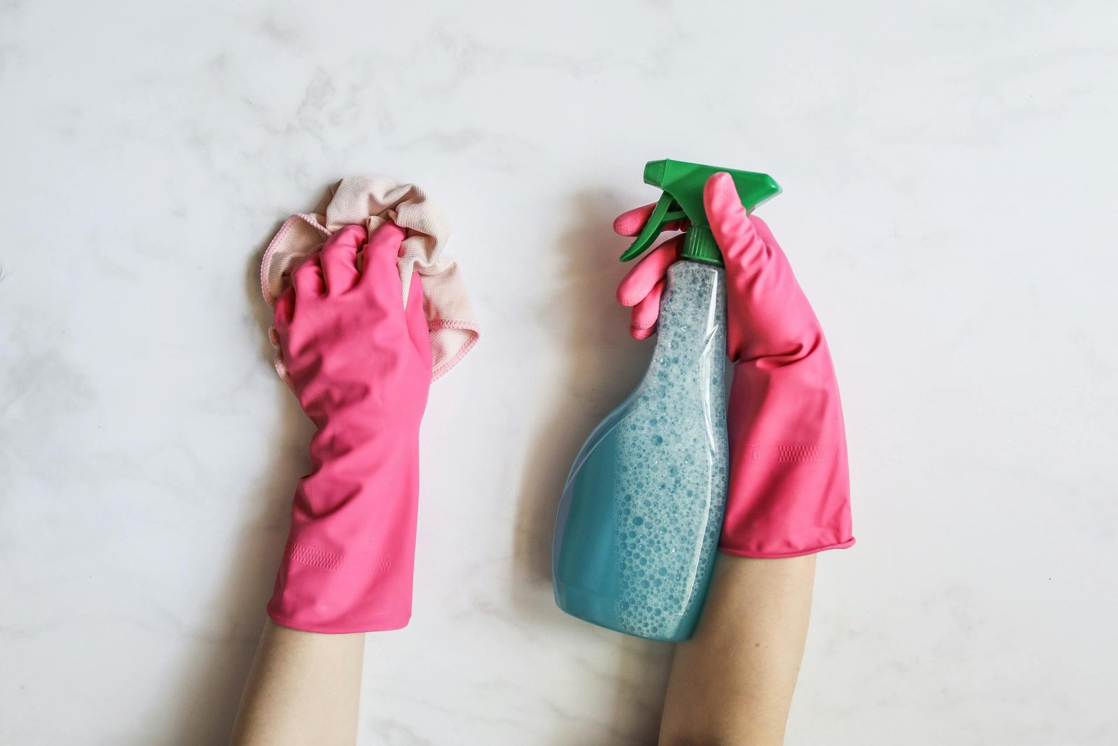 A Person Cleaning Using Cleaning Products